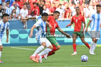 2024-07-24 - Ezequiel Fernandez of Argentina and Bilal El Khannouss of Morocco during the Football, Men's Group B, between Argentina and Morocco during the Olympic Games Paris 2024 on 24 July 2024 at Geoffroy-Guichard Stadium in Saint-Etienne, France - OLYMPIC GAMES PARIS 2024 - 24/07 - OLYMPIC GAMES PARIS 2024 - OLYMPIC GAMES