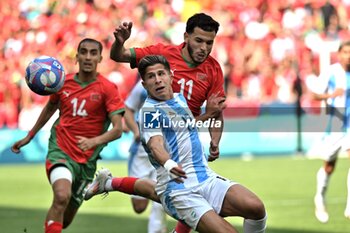 2024-07-24 - Giuliano Simeone of Argentina and Zakaria El Ouadi of Morocco during the Football, Men's Group B, between Argentina and Morocco during the Olympic Games Paris 2024 on 24 July 2024 at Geoffroy-Guichard Stadium in Saint-Etienne, France - OLYMPIC GAMES PARIS 2024 - 24/07 - OLYMPIC GAMES PARIS 2024 - OLYMPIC GAMES