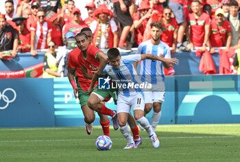 2024-07-24 - Oussama Thargalline of Morocco and Claudio Echeverri of Argentina during the Football, Men's Group B, between Argentina and Morocco during the Olympic Games Paris 2024 on 24 July 2024 at Geoffroy-Guichard Stadium in Saint-Etienne, France - OLYMPIC GAMES PARIS 2024 - 24/07 - OLYMPIC GAMES PARIS 2024 - OLYMPIC GAMES