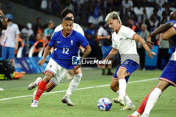 2024-07-24 - Enzo Millot (France) and John Tolkin (USA) during the Football, Men's Group A, between France and United States during the Olympic Games Paris 2024 on 24 July 2024 at Geoffroy-Guichard Stadium in Marseille, France - OLYMPIC GAMES PARIS 2024 - 24/07 - OLYMPIC GAMES PARIS 2024 - OLYMPIC GAMES