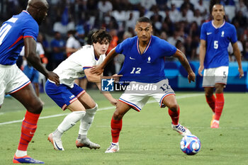 2024-07-24 - Enzo Millot (France) and Paxten Aaronson (USA) during the Football, Men's Group A, between France and United States during the Olympic Games Paris 2024 on 24 July 2024 at Geoffroy-Guichard Stadium in Marseille, France - OLYMPIC GAMES PARIS 2024 - 24/07 - OLYMPIC GAMES PARIS 2024 - OLYMPIC GAMES