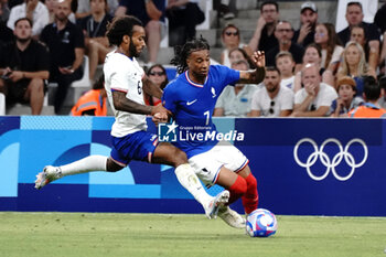 2024-07-24 - Michael Olise (France) and Gianluca Busio (USA) during the Football, Men's Group A, between France and United States during the Olympic Games Paris 2024 on 24 July 2024 at Geoffroy-Guichard Stadium in Marseille, France - OLYMPIC GAMES PARIS 2024 - 24/07 - OLYMPIC GAMES PARIS 2024 - OLYMPIC GAMES