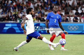 2024-07-24 - Castello Lukeba (France) and Gianluca Busio (USA) during the Football, Men's Group A, between France and United States during the Olympic Games Paris 2024 on 24 July 2024 at Geoffroy-Guichard Stadium in Marseille, France - OLYMPIC GAMES PARIS 2024 - 24/07 - OLYMPIC GAMES PARIS 2024 - OLYMPIC GAMES