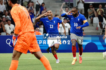 2024-07-24 - Alexandre Lacazette (France) celebrates his goal with Enzo Millot during the Football, Men's Group A, between France and United States during the Olympic Games Paris 2024 on 24 July 2024 at Geoffroy-Guichard Stadium in Marseille, France - OLYMPIC GAMES PARIS 2024 - 24/07 - OLYMPIC GAMES PARIS 2024 - OLYMPIC GAMES