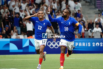 2024-07-24 - Alexandre Lacazette (France) celebrates his goal with Enzo Millot during the Football, Men's Group A, between France and United States during the Olympic Games Paris 2024 on 24 July 2024 at Geoffroy-Guichard Stadium in Marseille, France - OLYMPIC GAMES PARIS 2024 - 24/07 - OLYMPIC GAMES PARIS 2024 - OLYMPIC GAMES