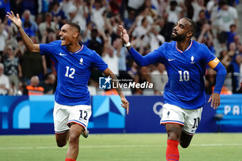 2024-07-24 - Alexandre Lacazette (France) celebrates his goal with Enzo Millot during the Football, Men's Group A, between France and United States during the Olympic Games Paris 2024 on 24 July 2024 at Geoffroy-Guichard Stadium in Marseille, France - OLYMPIC GAMES PARIS 2024 - 24/07 - OLYMPIC GAMES PARIS 2024 - OLYMPIC GAMES