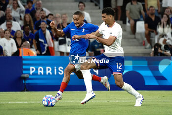 2024-07-24 - Enzo Millot (France) and Miles Robinson (USA) during the Football, Men's Group A, between France and United States during the Olympic Games Paris 2024 on 24 July 2024 at Geoffroy-Guichard Stadium in Marseille, France - OLYMPIC GAMES PARIS 2024 - 24/07 - OLYMPIC GAMES PARIS 2024 - OLYMPIC GAMES