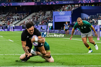 2024-07-24 - Moses Leo (New Zealand) scores a try, Rugby Sevens, Men's Pool A between New Zealand and South Africa during the Olympic Games Paris 2024 on 24 July 2024 at Stade de France in Saint-Denis, France - OLYMPIC GAMES PARIS 2024 - 24/07 - OLYMPIC GAMES PARIS 2024 - OLYMPIC GAMES