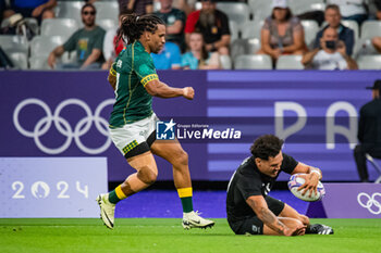 2024-07-24 - Moses Leo (New Zealand) and Roscko Speckman (South Africa), Rugby Sevens, Men's Pool A between New Zealand and South Africa during the Olympic Games Paris 2024 on 24 July 2024 at Stade de France in Saint-Denis, France - OLYMPIC GAMES PARIS 2024 - 24/07 - OLYMPIC GAMES PARIS 2024 - OLYMPIC GAMES