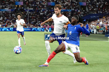 2024-07-24 - Manu Koné (France) and Tanner Tessmann (USA) during the Football, Men's Group A, between France and United States during the Olympic Games Paris 2024 on 24 July 2024 at Velodrome Stadium in Marseille, France - OLYMPIC GAMES PARIS 2024 - 24/07 - OLYMPIC GAMES PARIS 2024 - OLYMPIC GAMES