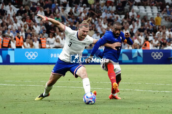 2024-07-24 - Walker Zimmerman (USA) and Alexandre Lacazette (France) during the Football, Men's Group A, between France and United States during the Olympic Games Paris 2024 on 24 July 2024 at Velodrome Stadium in Marseille, France - OLYMPIC GAMES PARIS 2024 - 24/07 - OLYMPIC GAMES PARIS 2024 - OLYMPIC GAMES