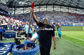 2024-07-24 - France and Marseille former player Basile Boli during the Football, Men's Group A, between France and United States during the Olympic Games Paris 2024 on 24 July 2024 at Velodrome Stadium in Marseille, France - OLYMPIC GAMES PARIS 2024 - 24/07 - OLYMPIC GAMES PARIS 2024 - OLYMPIC GAMES