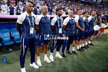 2024-07-24 - Head coach Thierry Henry of France, Assistant coach Gérald Baticle and Staff during the Football, Men's Group A, between France and United States during the Olympic Games Paris 2024 on 24 July 2024 at Velodrome Stadium in Marseille, France - OLYMPIC GAMES PARIS 2024 - 24/07 - OLYMPIC GAMES PARIS 2024 - OLYMPIC GAMES