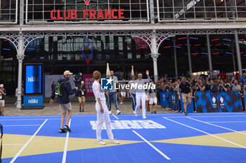 2024-07-26 - Olympic Torch Relay during the opening ceremony of the Olympic Games Paris 2024 on 26 July 2024 in Paris, France - OLYMPIC GAMES PARIS 2024 - OPENING CEREMONY - 26/07 - OLYMPIC GAMES PARIS 2024 - OLYMPIC GAMES