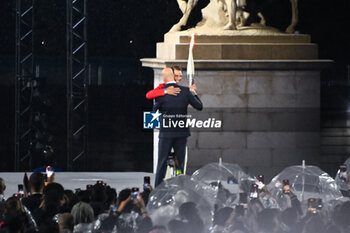 2024-07-26 - Rafael Nadal and Zinadine Zidane with the Olympic torch, Opening Ceremony during the Olympic Games Paris 2024 on 26 July 2024 in Paris, France - OLYMPIC GAMES PARIS 2024 - OPENING CEREMONY - 26/07 - OLYMPIC GAMES PARIS 2024 - OLYMPIC GAMES