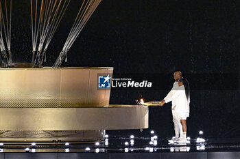 2024-07-26 - Teddy Riner and Marie-José Pérec light the Olympic cauldron, Opening Ceremony during the Olympic Games Paris 2024 on 26 July 2024 in Paris, France - OLYMPIC GAMES PARIS 2024 - OPENING CEREMONY - 26/07 - OLYMPIC GAMES PARIS 2024 - OLYMPIC GAMES