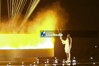 2024-07-26 - Teddy Riner and Marie-José Pérec light the Olympic cauldron, Opening Ceremony during the Olympic Games Paris 2024 on 26 July 2024 in Paris, France - OLYMPIC GAMES PARIS 2024 - OPENING CEREMONY - 26/07 - OLYMPIC GAMES PARIS 2024 - OLYMPIC GAMES