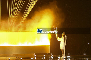 2024-07-26 - Teddy Riner and Marie-José Pérec light the Olympic cauldron, Opening Ceremony during the Olympic Games Paris 2024 on 26 July 2024 in Paris, France - OLYMPIC GAMES PARIS 2024 - OPENING CEREMONY - 26/07 - OLYMPIC GAMES PARIS 2024 - OLYMPIC GAMES