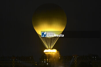 2024-07-26 - The cauldron, with the Olympic flame lit, lifting off attached to a balloon, Opening Ceremony during the Olympic Games Paris 2024 on 26 July 2024 in Paris, France - OLYMPIC GAMES PARIS 2024 - OPENING CEREMONY - 26/07 - OLYMPIC GAMES PARIS 2024 - OLYMPIC GAMES