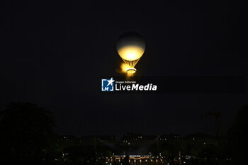 2024-07-26 - The cauldron, with the Olympic flame lit, lifting off attached to a balloon, Opening Ceremony during the Olympic Games Paris 2024 on 26 July 2024 in Paris, France - OLYMPIC GAMES PARIS 2024 - OPENING CEREMONY - 26/07 - OLYMPIC GAMES PARIS 2024 - OLYMPIC GAMES