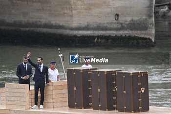 2024-07-26 - Martin Fourcade and Michael Phelps, Louis Vuitton Torches trunks protecting the Olympic and Paralympic flames of Paris 2024, Opening Ceremony during the Olympic Games Paris 2024 on 26 July 2024 in Paris, France - OLYMPIC GAMES PARIS 2024 - OPENING CEREMONY - 26/07 - OLYMPIC GAMES PARIS 2024 - OLYMPIC GAMES