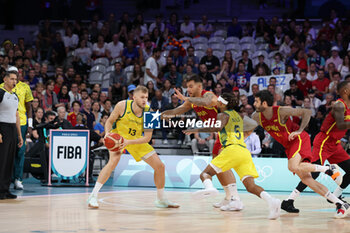 2024-07-27 - Jock Landale of Australia and Willy Hernangómez of Spain, Basketball, Men's Group Phase - Group A between Australia and Spain during the Olympic Games Paris 2024 on 27 July 2024 in Villeneuve-d'Ascq near Lille, France - OLYMPIC GAMES PARIS 2024 - 27/07 - OLYMPIC GAMES PARIS 2024 - OLYMPIC GAMES