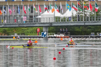 2024-07-27 - Mihai Chiruta of Romania and Damir Martin of Croatia, Rowing, Men's Single Sculls Heats, during the Olympic Games Paris 2024 on 27 July 2024 at Vaires-Sur-Marne Nautical Stadium in Vaires-sur-Marne, France - OLYMPIC GAMES PARIS 2024 - 27/07 - OLYMPIC GAMES PARIS 2024 - OLYMPIC GAMES