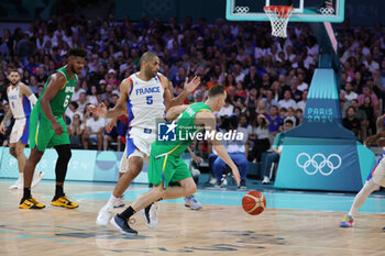 2024-07-27 - Marcelinho Huertas of Brazil and Nicolas Batum of France, Basketball, Men's Group Phase - Group B between France and Brazil during the Olympic Games Paris 2024 on 27 July 2024 in Villeneuve-d'Ascq near Lille, France - OLYMPIC GAMES PARIS 2024 - 27/07 - OLYMPIC GAMES PARIS 2024 - OLYMPIC GAMES