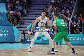 2024-07-27 - Marcelinho Huertas of Brazil and Nando de Colo of France, Basketball, Men's Group Phase - Group B between France and Brazil during the Olympic Games Paris 2024 on 27 July 2024 in Villeneuve-d'Ascq near Lille, France - OLYMPIC GAMES PARIS 2024 - 27/07 - OLYMPIC GAMES PARIS 2024 - OLYMPIC GAMES