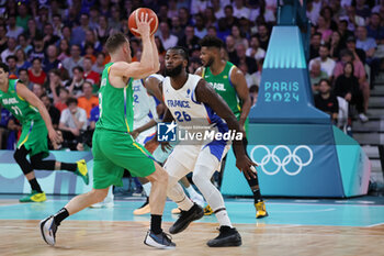 2024-07-27 - Marcelinho Huertas of Brazil and Mathias Lessort of France, Basketball, Men's Group Phase - Group B between France and Brazil during the Olympic Games Paris 2024 on 27 July 2024 in Villeneuve-d'Ascq near Lille, France - OLYMPIC GAMES PARIS 2024 - 27/07 - OLYMPIC GAMES PARIS 2024 - OLYMPIC GAMES