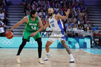 2024-07-27 - Léo Meindl of Brazil and Evan Fournier of France, Basketball, Men's Group Phase - Group B between France and Brazil during the Olympic Games Paris 2024 on 27 July 2024 in Villeneuve-d'Ascq near Lille, France - OLYMPIC GAMES PARIS 2024 - 27/07 - OLYMPIC GAMES PARIS 2024 - OLYMPIC GAMES