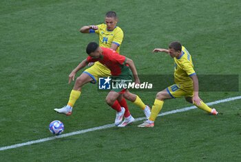 2024-07-27 - Bilal El Khannouss (Morocco) and Danylo Sikan Maksym Braharu (Ukraine), Football, Men's Group B between Ukraine and Morocco during the Olympic Games Paris 2024 on 27 July 2024 at Geoffroy-Guichard Stadium in Saint-Etienne, France - OLYMPIC GAMES PARIS 2024 - 27/07 - OLYMPIC GAMES PARIS 2024 - OLYMPIC GAMES