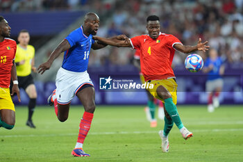 2024-07-27 - Jean-Philippe Mateta (France) and Mohamed Soumah (Guinea), Football, Men's Group A between France and Guinea during the Olympic Games Paris 2024 on 27 July 2024 at Allianz Riviera in Nice, France - OLYMPIC GAMES PARIS 2024 - 27/07 - OLYMPIC GAMES PARIS 2024 - OLYMPIC GAMES