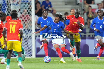 2024-07-27 - Michael Olise (France) and Abdoulaye Touré (Guinea), Football, Men's Group A between France and Guinea during the Olympic Games Paris 2024 on 27 July 2024 at Allianz Riviera in Nice, France - OLYMPIC GAMES PARIS 2024 - 27/07 - OLYMPIC GAMES PARIS 2024 - OLYMPIC GAMES