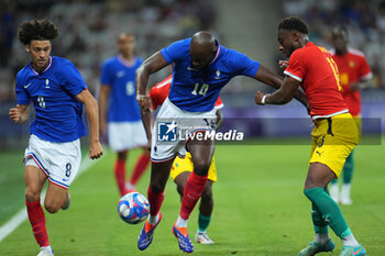 2024-07-27 - Jean-Philippe Mateta (France) and Madiou Keita (Guinea), Football, Men's Group A between France and Guinea during the Olympic Games Paris 2024 on 27 July 2024 at Allianz Riviera in Nice, France - OLYMPIC GAMES PARIS 2024 - 27/07 - OLYMPIC GAMES PARIS 2024 - OLYMPIC GAMES