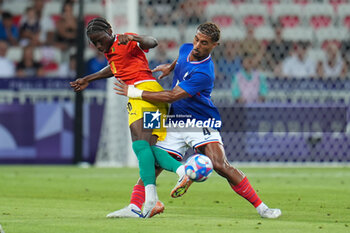 2024-07-27 - Moriba Ilaix (Guinea) and Loïc Badé (France), Football, Men's Group A between France and Guinea during the Olympic Games Paris 2024 on 27 July 2024 at Allianz Riviera in Nice, France - OLYMPIC GAMES PARIS 2024 - 27/07 - OLYMPIC GAMES PARIS 2024 - OLYMPIC GAMES