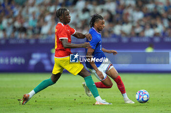 2024-07-27 - Michael Olise (France) and Moriba Ilaix (Guinea), Football, Men's Group A between France and Guinea during the Olympic Games Paris 2024 on 27 July 2024 at Allianz Riviera in Nice, France - OLYMPIC GAMES PARIS 2024 - 27/07 - OLYMPIC GAMES PARIS 2024 - OLYMPIC GAMES