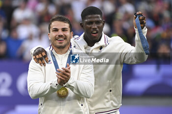 2024-07-27 - Antoine Dupont (France) celebrates the victory with Andy Timo, Rugby Sevens, Men's final between France and Fiji during the Olympic Games Paris 2024 on 27 July 2024 at Stade de France in Saint-Denis, France - OLYMPIC GAMES PARIS 2024 - 27/07 - OLYMPIC GAMES PARIS 2024 - OLYMPIC GAMES