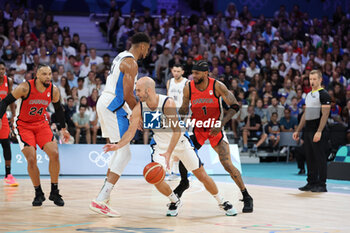 2024-07-27 - Nick Calathes of Greece and Nickeil Alexander-Walker of Canada, Basketball, Men's Group Phase - Group A between Greece and Canada during the Olympic Games Paris 2024 on 27 July 2024 in Villeneuve-d'Ascq near Lille, France - OLYMPIC GAMES PARIS 2024 - 27/07 - OLYMPIC GAMES PARIS 2024 - OLYMPIC GAMES