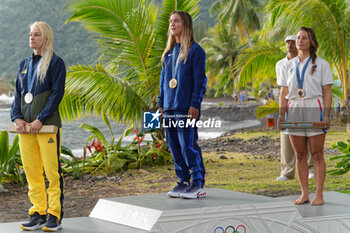 2024-08-05 - Tatiana Weston-Webb of Brazil Silver medal, Caroline Marks of USA Gold medal, Johanne Defay of France Bronze medal, Surfing, Women's during the Olympic Games Paris 2024 on 6 August 2024 at Teahupo'o in Tahiti, French Polynesia - OLYMPIC GAMES PARIS 2024 - 06/08 - OLYMPIC GAMES PARIS 2024 - OLYMPIC GAMES