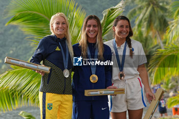 2024-08-05 - Tatiana Weston-Webb of Brazil Silver medal, Caroline Marks of USA Gold medal, Johanne Defay of France Bronze medal, Surfing, Women's during the Olympic Games Paris 2024 on 6 August 2024 at Teahupo'o in Tahiti, French Polynesia - OLYMPIC GAMES PARIS 2024 - 06/08 - OLYMPIC GAMES PARIS 2024 - OLYMPIC GAMES