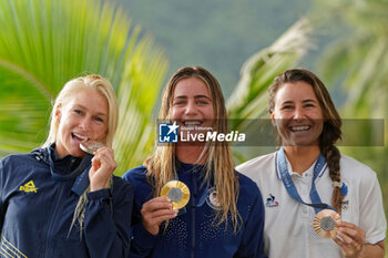 2024-08-05 - Tatiana Weston-Webb of Brazil Silver medal, Caroline Marks of USA Gold medal, Johanne Defay of France Bronze medal, Surfing, Women's during the Olympic Games Paris 2024 on 6 August 2024 at Teahupo'o in Tahiti, French Polynesia - OLYMPIC GAMES PARIS 2024 - 06/08 - OLYMPIC GAMES PARIS 2024 - OLYMPIC GAMES