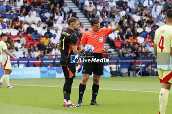 2024-08-09 - Arnau Tenas of Spain with referee Ramon Abatti, Football, Men's Gold Medal Match between France and Spain during the Olympic Games Paris 2024 on 9 August 2024 at Parc des Princes in Paris, France - OLYMPIC GAMES PARIS 2024 - 09/08 - OLYMPIC GAMES PARIS 2024 - OLYMPIC GAMES