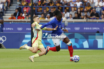 2024-08-09 - Manu Koné of France is fouled by Fermín López of Spain, Football, Men's Gold Medal Match between France and Spain during the Olympic Games Paris 2024 on 9 August 2024 at Parc des Princes in Paris, France - OLYMPIC GAMES PARIS 2024 - 09/08 - OLYMPIC GAMES PARIS 2024 - OLYMPIC GAMES