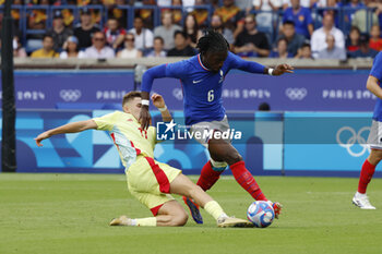 2024-08-09 - Manu Koné of France is fouled by Fermín López of Spain, Football, Men's Gold Medal Match between France and Spain during the Olympic Games Paris 2024 on 9 August 2024 at Parc des Princes in Paris, France - OLYMPIC GAMES PARIS 2024 - 09/08 - OLYMPIC GAMES PARIS 2024 - OLYMPIC GAMES