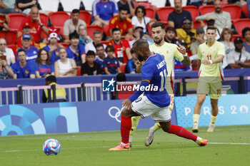 2024-08-09 - Alex Baena of Spain and Alexandre Lacazette of France, Football, Men's Gold Medal Match between France and Spain during the Olympic Games Paris 2024 on 9 August 2024 at Parc des Princes in Paris, France - OLYMPIC GAMES PARIS 2024 - 09/08 - OLYMPIC GAMES PARIS 2024 - OLYMPIC GAMES