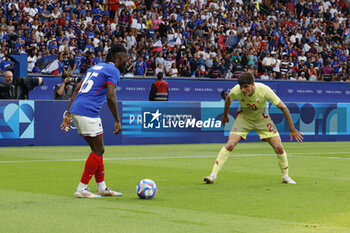 2024-08-09 - Bradley Locko of France and Juanlu Sánchez of Spain, Football, Men's Gold Medal Match between France and Spain during the Olympic Games Paris 2024 on 9 August 2024 at Parc des Princes in Paris, France - OLYMPIC GAMES PARIS 2024 - 09/08 - OLYMPIC GAMES PARIS 2024 - OLYMPIC GAMES