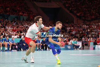 2024-08-09 - Aleks Vlah (Slovenia) and Niclas Kirkelokke (Denmark), Handball, Men's Semifinal between Slovenia and Denmark during the Olympic Games Paris 2024 on 9 August 2024 at Pierre Mauroy stadium in Villeneuve-d'Ascq near Lille, France - OLYMPIC GAMES PARIS 2024 - 09/08 - OLYMPIC GAMES PARIS 2024 - OLYMPIC GAMES