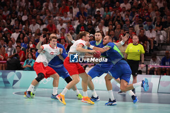 2024-08-09 - Simon Pytlick (Denmark) and Borut Mackovsek (Slovenia), Handball, Men's Semifinal between Slovenia and Denmark during the Olympic Games Paris 2024 on 9 August 2024 at Pierre Mauroy stadium in Villeneuve-d'Ascq near Lille, France - OLYMPIC GAMES PARIS 2024 - 09/08 - OLYMPIC GAMES PARIS 2024 - OLYMPIC GAMES