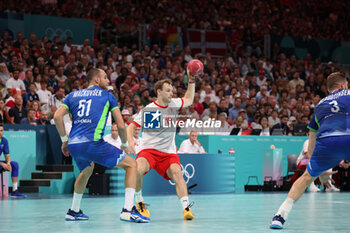 2024-08-09 - Mathias Gidsel (Denmark) and Borut Mackovsek (Slovenia), Handball, Men's Semifinal between Slovenia and Denmark during the Olympic Games Paris 2024 on 9 August 2024 at Pierre Mauroy stadium in Villeneuve-d'Ascq near Lille, France - OLYMPIC GAMES PARIS 2024 - 09/08 - OLYMPIC GAMES PARIS 2024 - OLYMPIC GAMES